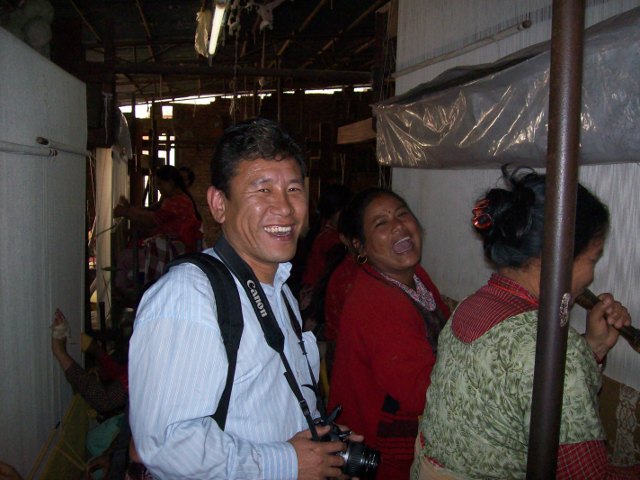 Rug weaves and friend in Nepal