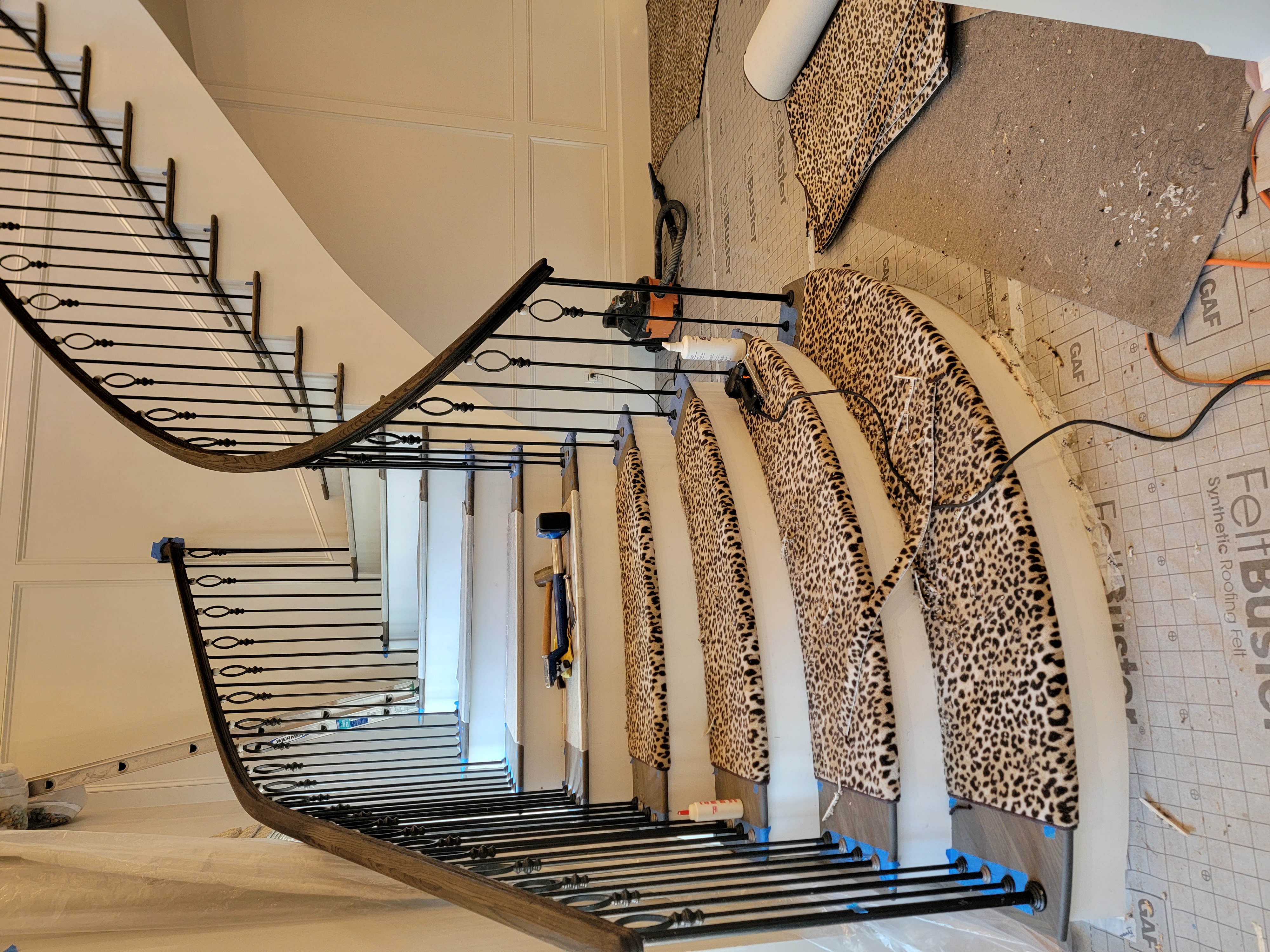 Leopard patterned stair runner at the beginning of the installation.