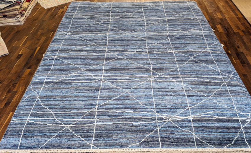 Contemporary hand-knotted rug in blue.