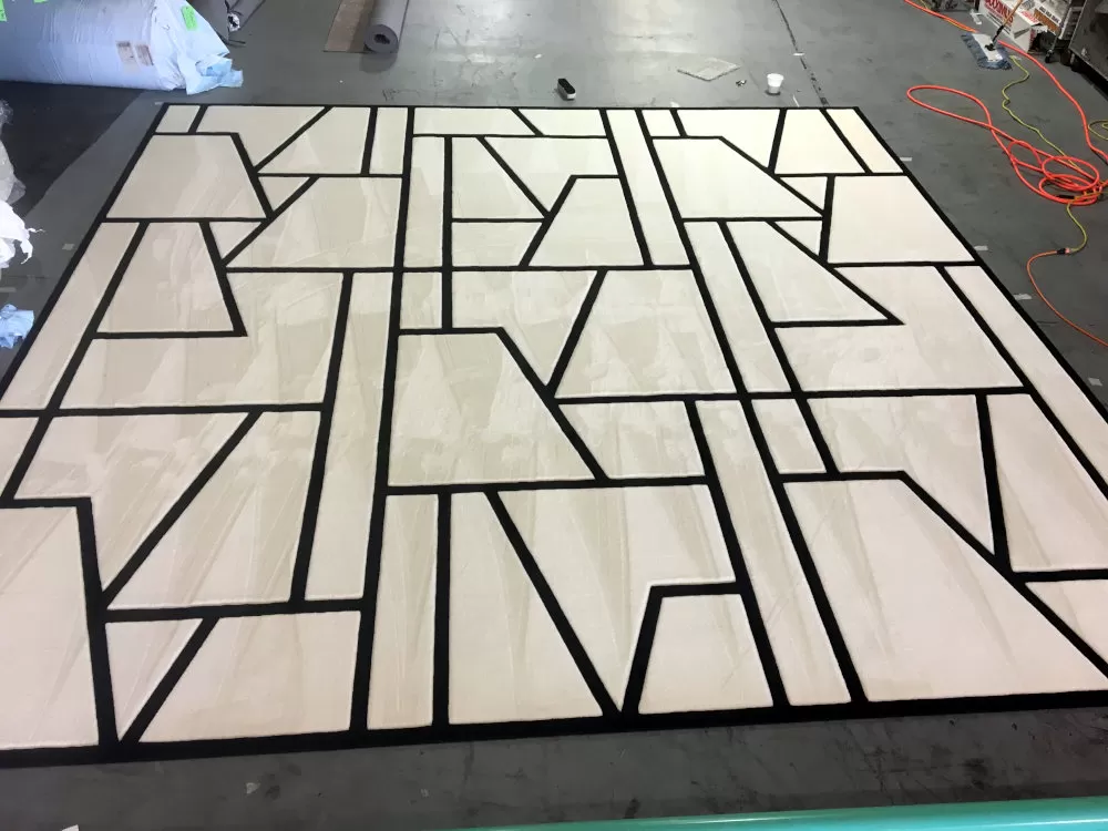 White rug with abstract black line pattern