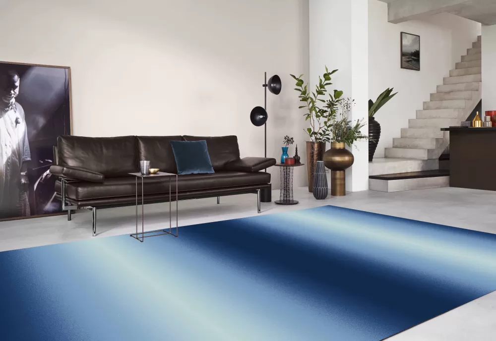 Ombre rug with blue fading into cream.