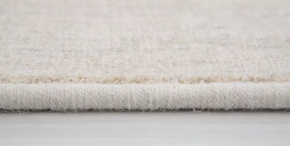 Machine serged rug