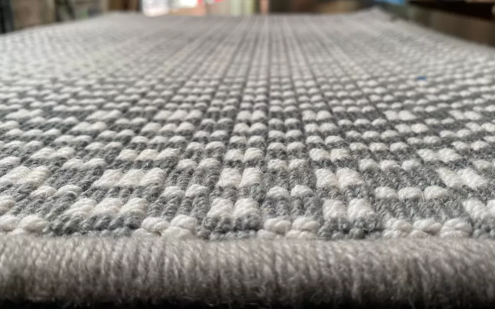 Closeup of surface of hand-loomed rug.