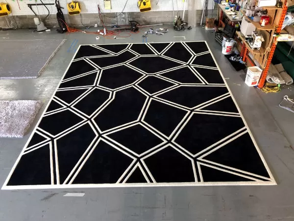 Formatted rug trimmed with double white lines.