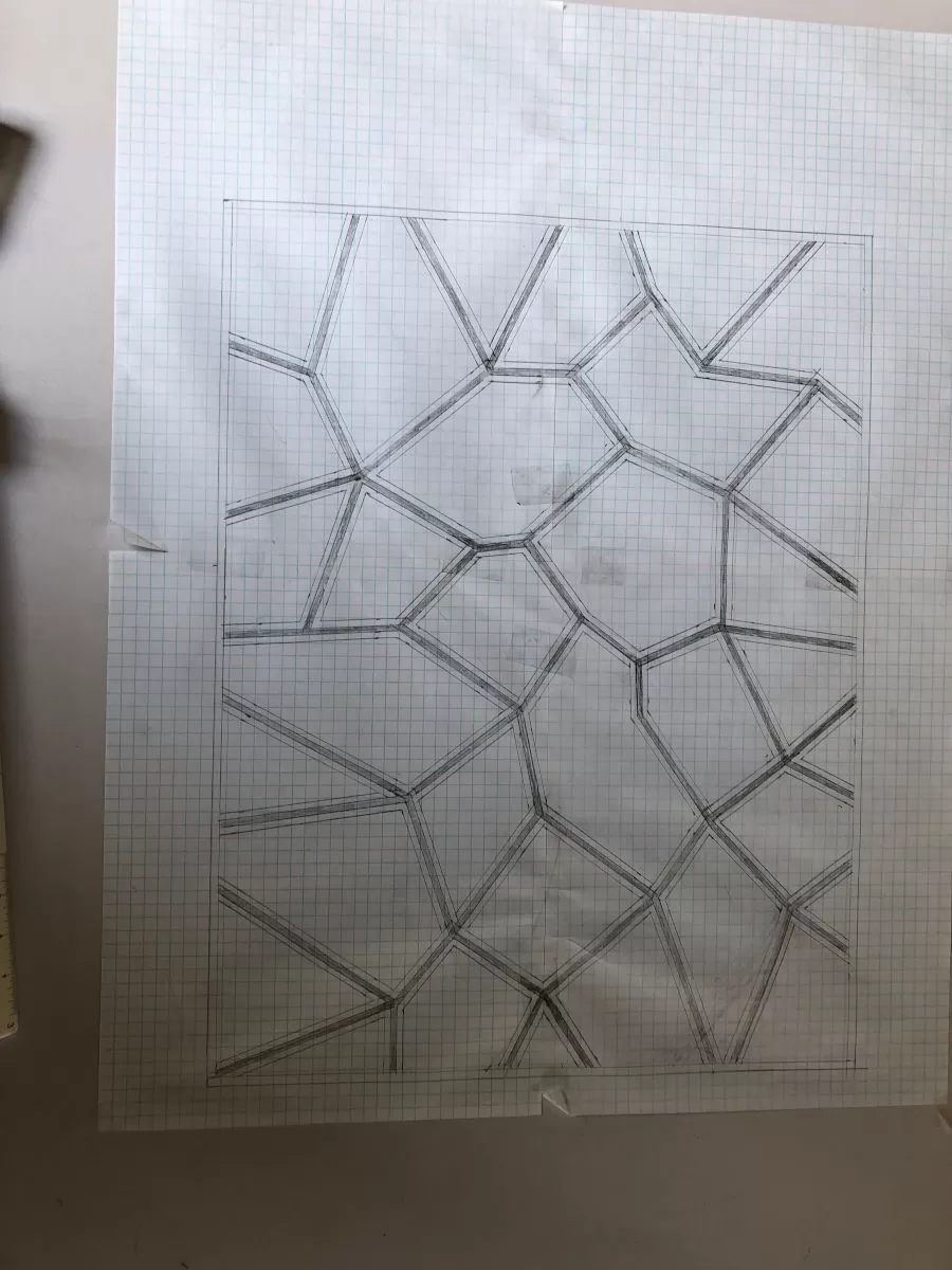 Scale drawing of a rug on graph paper.