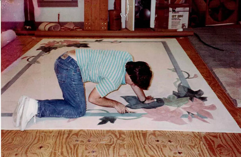 Formatted rug inlaid with decorative border.