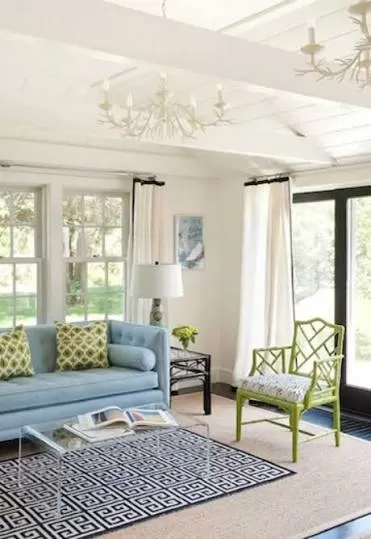 Geometric rug on top of a sisal rug
