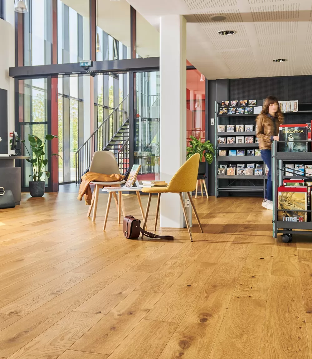 Honey colored, wide plank French White Oak.