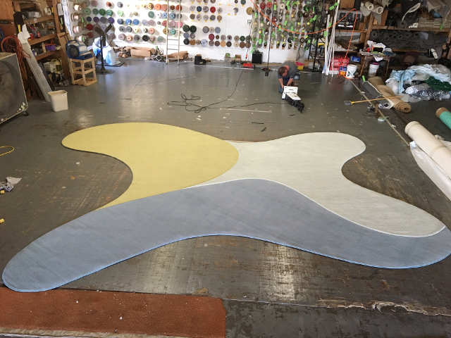 Custom fabricated rug on the floor of the shop