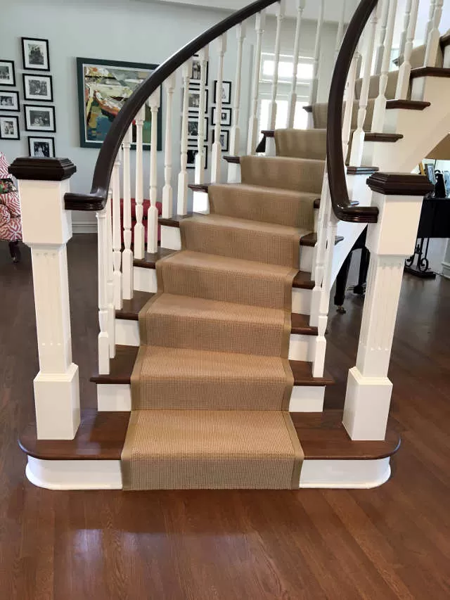 Curving stair runner with binding.