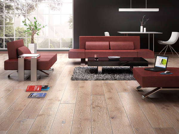 Knotty wood floor with maroon furniture