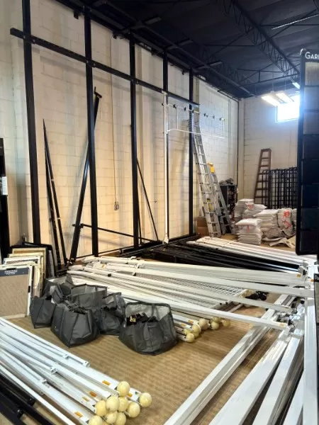 Rug hanging racks ready to be installed.