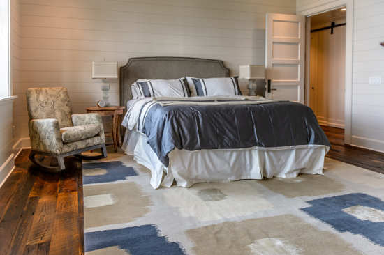 Custom hand knotted urg in bedroom