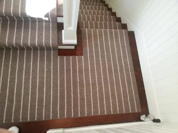 Striped stair runner in 180 degree turn.