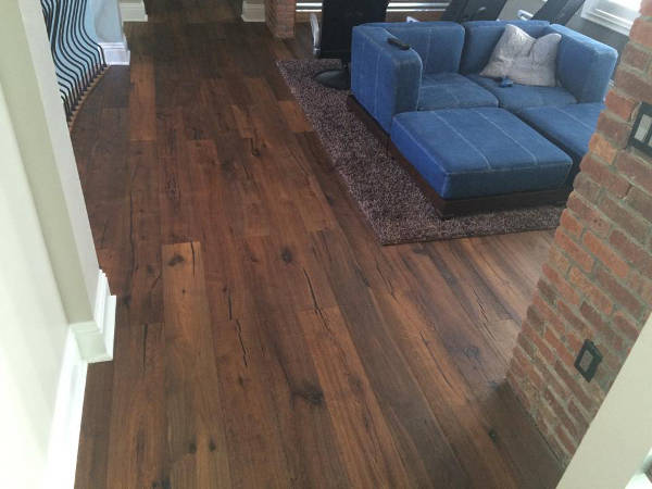 Modern entertainment room with rustic flooring