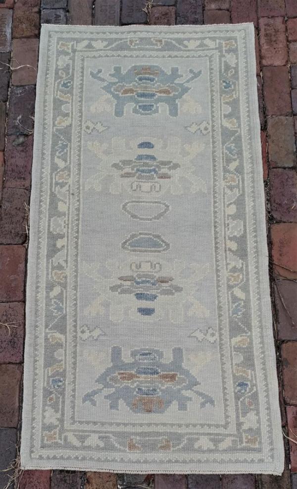 Small Anatolian area rug in greys