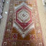 Wool, hand-knotted foyer rug.