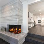Modern condo design with dark wood flooring and fireplace