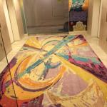 Colorful custom made rug in elevator lobby