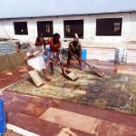Washing a new rug at factory in India