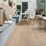 White oak floor in open, sunny room.